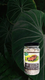Our award winning Steak Rub with Aloha on a tropical background showing a forest and waterfall.