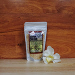 7 oz. Hawaiian Chili Pepper Sea Salt on a wooden background.