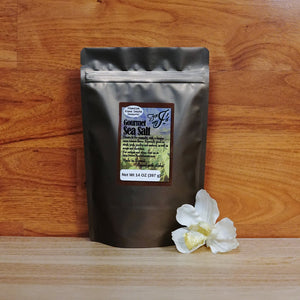 
                  
                    14 oz. Kiawe Smoke Sea Salt on a wooden background.t
                  
                