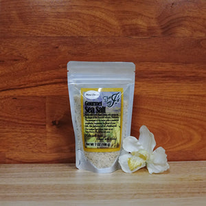 
                  
                    7 oz. Maui Onion Sea Salt on a wooden background.
                  
                