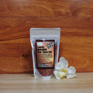 
                  
                    7 oz. Red 'Alaea Garlic Sea Salt on a wooden background.
                  
                