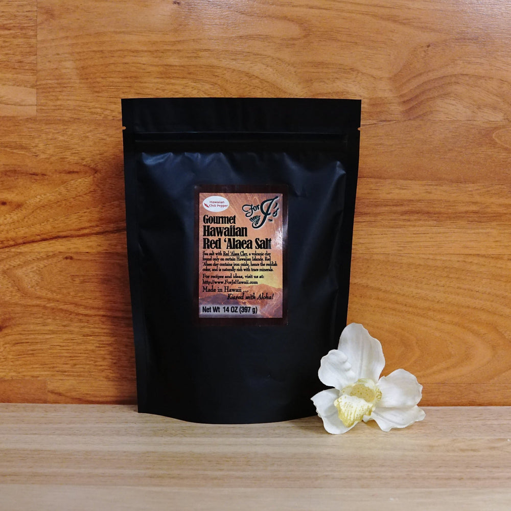 14 oz. Red 'Alaea Hawaiian Chili Pepper Sea Salt on a wooden background.