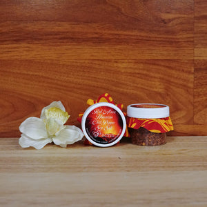 
                  
                    2oz. Red 'Alaea Hawaiian Chili Pepper Sea Salt on a wooden background.
                  
                