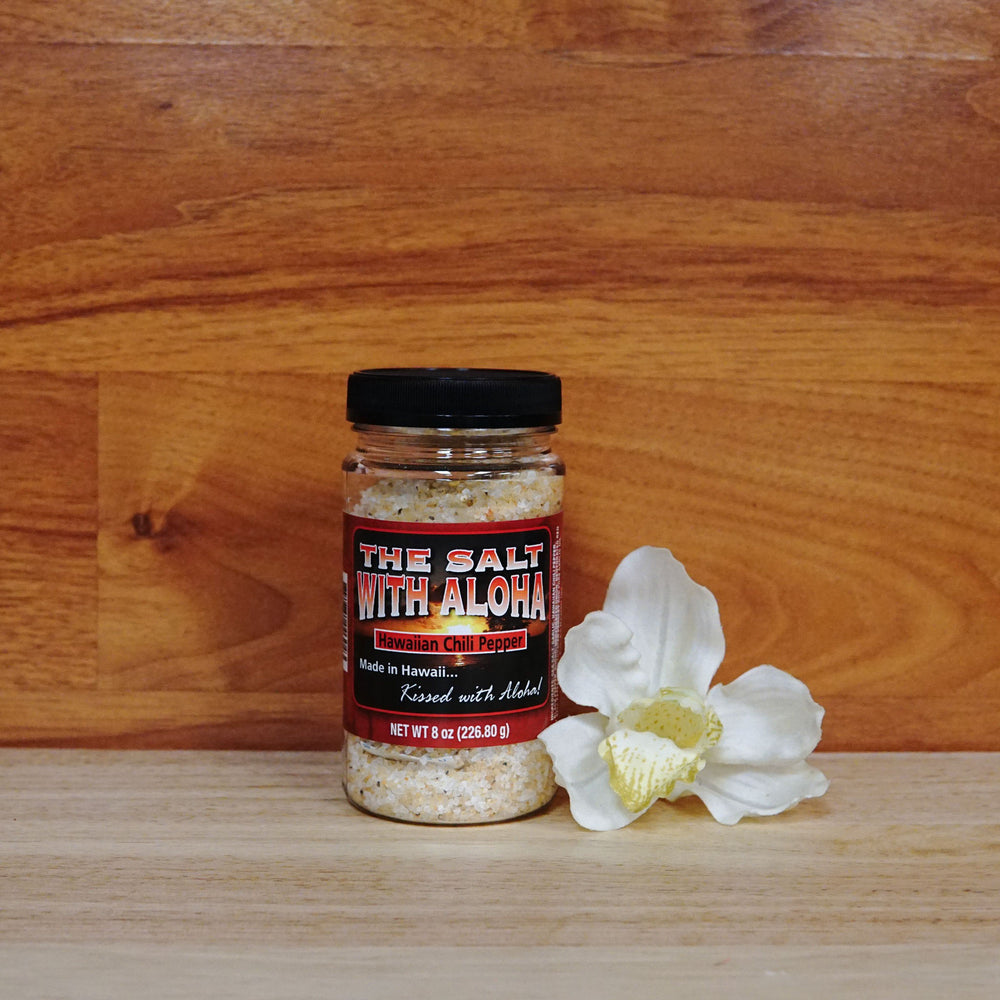
                  
                    Hawaiian Chili flavor of "Salt with Aloha" on a wooden background.
                  
                